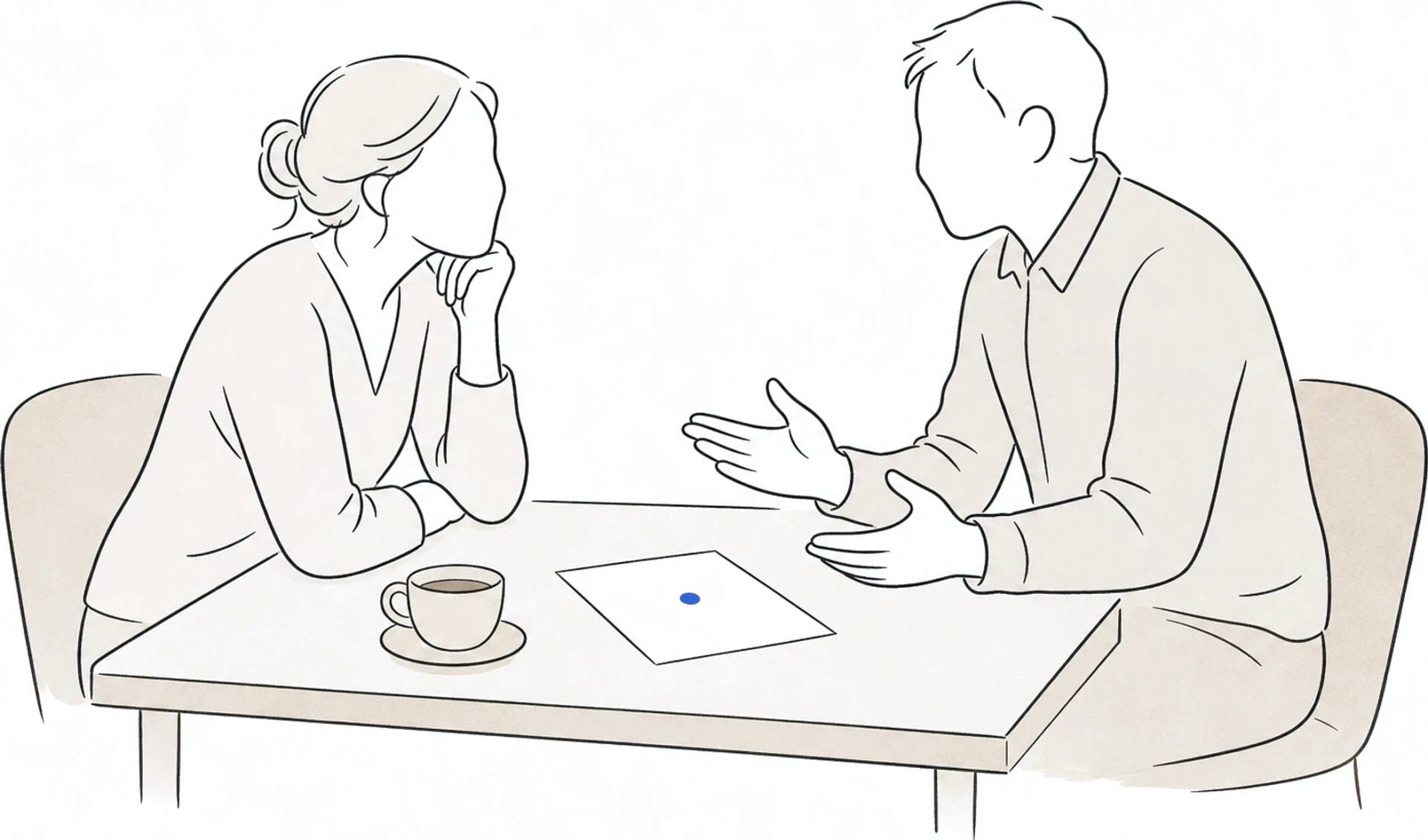 Two people in an unhurried conversation across a small desk, one listening with a cup of tea and a single sheet of paper between them.